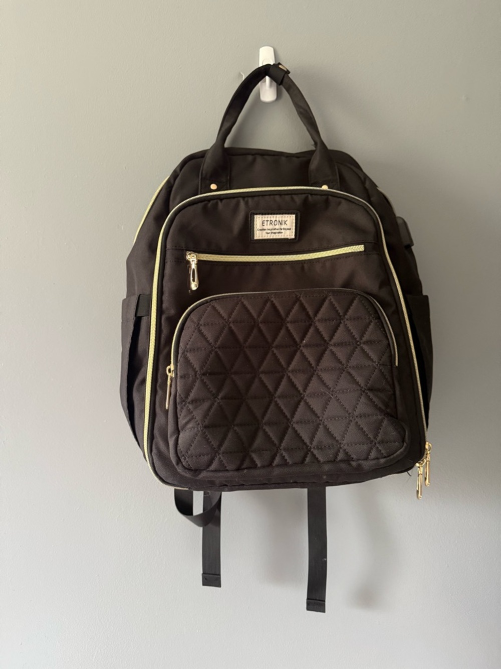 Black Quilted Backpack with Gold Trim